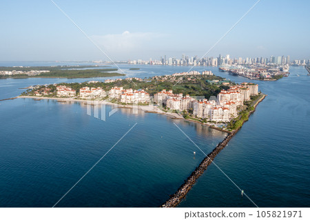 Aerial view of Fisher Island with City of Miami skyline in background. 105821971