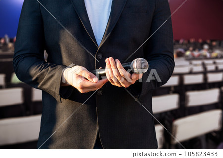 Man holding a microphone. Man holding a microphone. 105823433