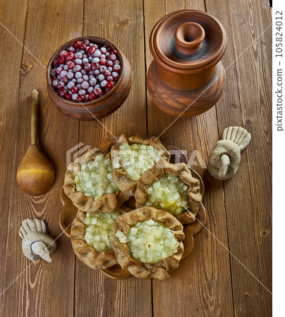 Karelian pasty with apples Karelian pasty with apples 105824012