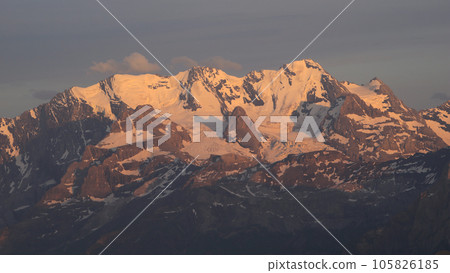 Bluemlisalp Range at sunset, view from Niesen Kulm, Switzerland. 105826185
