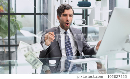 Happy emotional man in the office working with a computer. 105827333