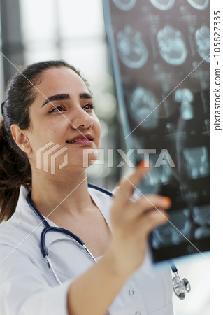 Brain disease diagnosis with medical doctor diagnosing elderly ageing patient 105827335