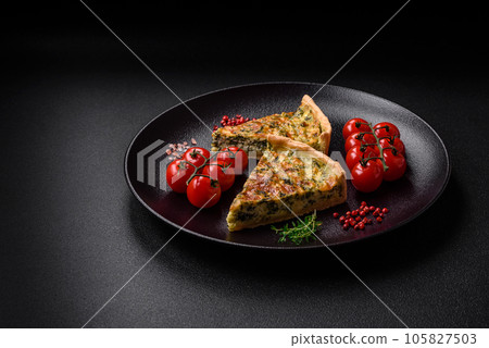 Delicious fresh quiche with broccoli, cheese, spices and herbs cut into pieces Delicious fresh quiche with broccoli, cheese, spices and herbs cut into pieces 105827503