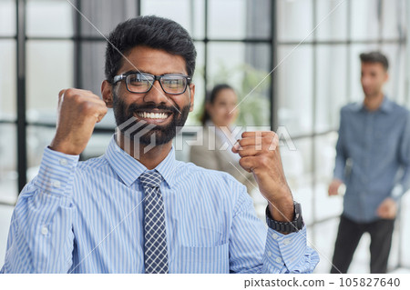 a man holding his hand up a gesture of triumph and victory. a man holding his hand up a gesture of triumph and victory. 105827640