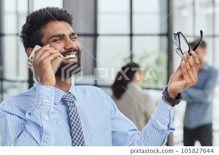 professional businessman executive entrepreneur wearing holding telephone making corporate call on cellphone. professional businessman executive entrepreneur wearing holding telephone making corporate call on cellphone. 105827644