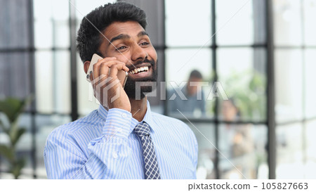 Close up portrait business man talking over cell phone. Close up portrait business man talking over cell phone. 105827663