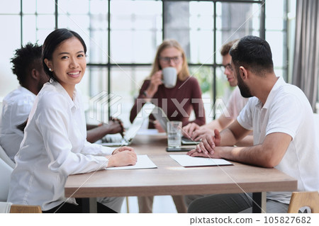 Group of happy business people in a meeting at office 105827682