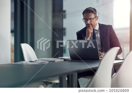 Business man, computer and thinking, ideas and reading online for decision, choice or solution in review or report. Planning, focus and problem solving of corporate person or ceo on laptop in office 105828809