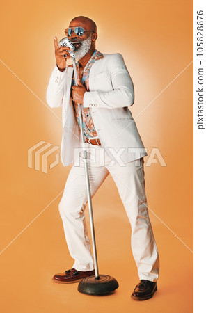 Be whatever you want to be. you might inspire others. Studio shot of a senior man wearing vintage clothes while singing into a microphone. 105828876