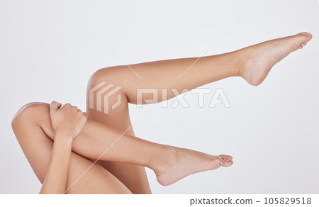 Those legs just dont quit. Studio shot of an unrecognizable young womans legs against a grey background. Those legs just dont quit. Studio shot of an unrecognizable young womans legs against a grey background. 105829518