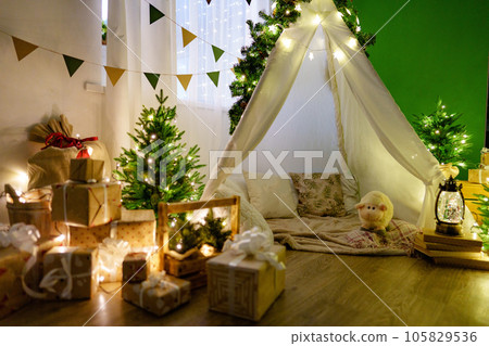 Christmas interior of a children's room with teepee Christmas interior of a children's room with teepee 105829536