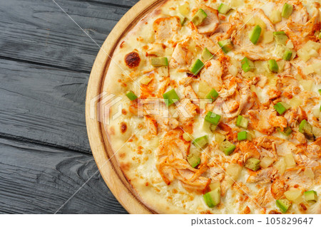 Fresh tasty pizza on black wooden background 105829647