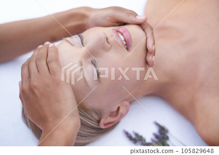Relax, reiki and facial massage, woman in spa for health, wellness and luxury treatment with eyes closed. Beauty salon, professional skin care therapist hands and face of girl with cosmetic therapy. 105829648