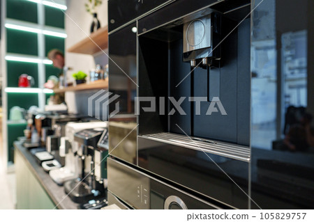 Row of many coffee machines on sale in store Row of many coffee machines on sale in store 105829757