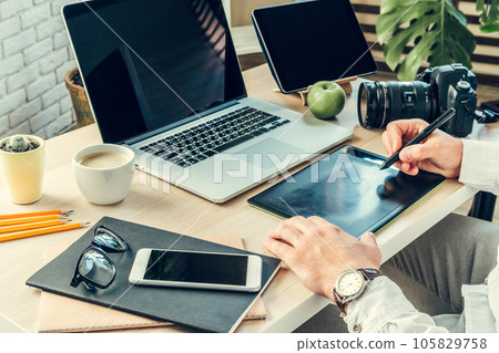 Close up of a working table of a businessman with laptop Close up of a working table of a businessman with laptop 105829758