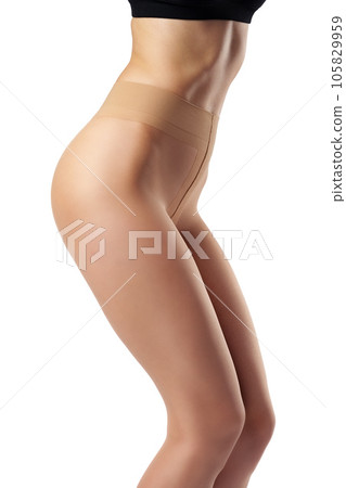 Legs of slim woman in tights on white background Legs of slim woman in tights on white background 105829959