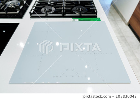 Modern cooking stoves on display in the store Modern cooking stoves on display in the store 105830042