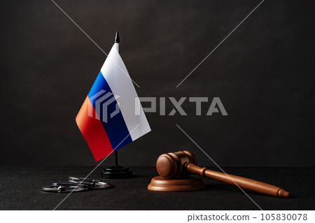 Russia flag with judge mallet and handcuffs on black background Russia flag with judge mallet and handcuffs on black background 105830078