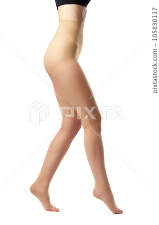 Legs of slim woman in tights on white background 105830117