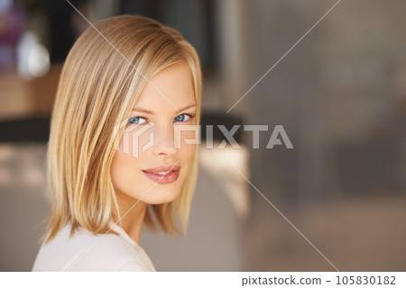 Face, natural beauty of woman and confidence or proud in blurred background at home. Stylish, relaxed or elegance and a serious female person in closeup with mockup indoors at their house in Denmark 105830182
