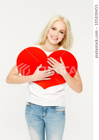 Heart, sign and portrait of woman in studio for love, paper and emoji against a white background. Face, shape and girl showing care, affection and self love, happy and content, young and beautiful Heart, sign and portrait of woman in studio for love, paper and emoji against a white background. Face, shape and girl showing care, affection and self love, happy and content, young and beautiful 105830455