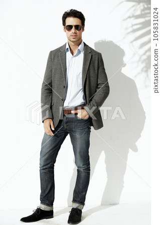 Cool, sunglasses and portrait of a man with fashion isolated on a white background in a studio. Stylish, young and a model with confidence and fashionable clothes with shades and shadow on backdrop Cool, sunglasses and portrait of a man with fashion isolated on a white background in a studio. Stylish, young and a model with confidence and fashionable clothes with shades and shadow on backdrop 105831024