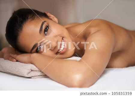 Portrait of happy girl, smile or massage to relax for zen resting or wellness physical therapy in spa hotel. Face of woman smiling in salon resort for body healing treatment or holistic detox therapy Portrait of happy girl, smile or massage to relax for zen resting or wellness physical therapy in spa hotel. Face of woman smiling in salon resort for body healing treatment or holistic detox therapy 105831359