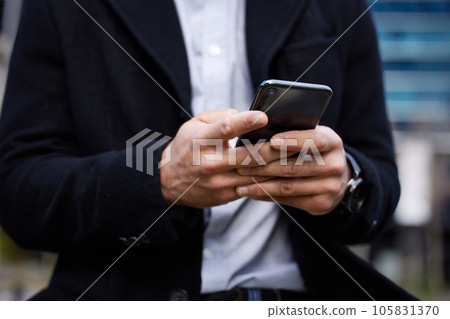 Business man, phone and hands typing outdoor for communication, social media or chat. Closeup of male entrepreneur person with smartphone in city for network, internet connection or mobile travel app 105831370