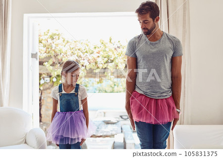 Man with girl, ballet dancing and teaching with learning at home in tutu, bond with love and creativity. Family, father and daughter dance in living room, ballerina lesson and spending time together Man with girl, ballet dancing and teaching with learning at home in tutu, bond with love and creativity. Family, father and daughter dance in living room, ballerina lesson and spending time together 105831375