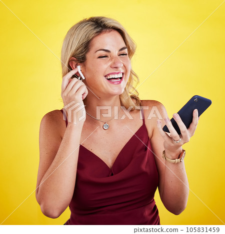 Phone, music earphones and woman singing in studio isolated on a yellow background. Cellphone, happiness and female person listening, hearing and streaming audio album, sound track or radio podcast. Phone, music earphones and woman singing in studio isolated on a yellow background. Cellphone, happiness and female person listening, hearing and streaming audio album, sound track or radio podcast. 105831459