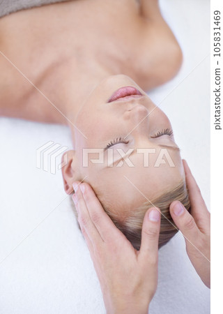 Relax, facial massage and acupressure, woman at beauty salon for health and wellness in luxury skincare treatment. Spa, professional skin care therapist and girl in cosmetic therapy for healthy face. 105831469