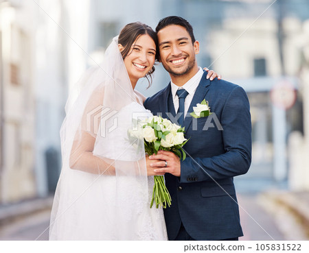 Portrait, bride and groom at wedding in city outdoors happy to start a happy marriage journey together. Smile, save the date and married couple holding a bouquet of flowers at a love celebration 105831522