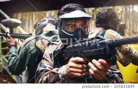 Men, teamwork or paintball gun in games arena, competition or sports challenge in military uniform. Soldiers, army or people and shooting paint equipment in warfare training or battlefield protection Men, teamwork or paintball gun in games arena, competition or sports challenge in military uniform. Soldiers, army or people and shooting paint equipment in warfare training or battlefield protection 105831695