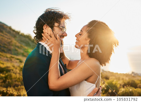 Love, wedding and couple on mountain kiss for marriage ceremony, commitment and celebration. Affection, romance and interracial bride and groom bonding, happy and smile with ocean sunset in Italy Love, wedding and couple on mountain kiss for marriage ceremony, commitment and celebration. Affection, romance and interracial bride and groom bonding, happy and smile with ocean sunset in Italy 105831792
