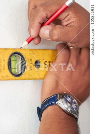 Spirit meter, man hands and pencil measure for maintenance, home improvement and repair. Construction, builder and contractor with ruler drawing on a wall for level measuring of handyman and line Spirit meter, man hands and pencil measure for maintenance, home improvement and repair. Construction, builder and contractor with ruler drawing on a wall for level measuring of handyman and line 105831931