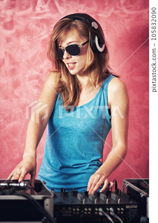 DJ woman, mixer and scratch with vinyl records, sunglasses and audio professional at club, studio or party. Girl, music and party with technology, turntable or techno for event, celebration or job 105832090