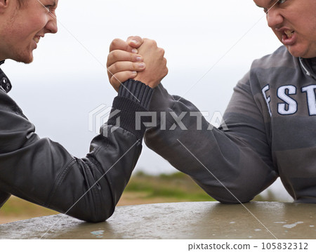 Closeup, friends and competition with men and arm wrestling in nature for challenge, power and respect. Team, strong and conflict with hands of people and holding hands for muscle, match and rival 105832312