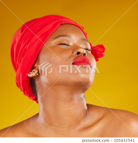 Beauty, makeup and creative with face of black woman in studio for facial, red head scarf and pride. Skincare, salon and red lipstick with model on yellow background for wellness, self care and glow 105832541