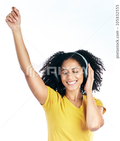 Dance, music and a woman with headphones in studio streaming audio, sound or radio. Energy, happy and a young african person isolated on a white background listening and moving to fun song to relax Dance, music and a woman with headphones in studio streaming audio, sound or radio. Energy, happy and a young african person isolated on a white background listening and moving to fun song to relax 105832555