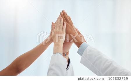 Closeup, doctors and nurses in hospital high five hands for team building success, motivation or healthcare support. Diversity, medical and people in achievement, collaboration and winner celebration Closeup, doctors and nurses in hospital high five hands for team building success, motivation or healthcare support. Diversity, medical and people in achievement, collaboration and winner celebration 105832719