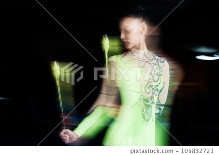Gymnastics, blur and woman with clubs for dance, rhythmic body movement and training. Black background, health and female dancer in action for aerobics competition, exercise and dancing performance Gymnastics, blur and woman with clubs for dance, rhythmic body movement and training. Black background, health and female dancer in action for aerobics competition, exercise and dancing performance 105832721