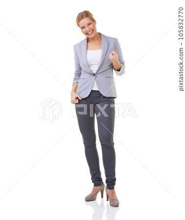 Shes an elegant woman. A beautiful blonde standing and smiling isolated on white. 105832770