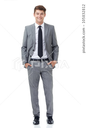 Hes a young up and comer in the corporate world. A handsome young businessman isolated on white. Hes a young up and comer in the corporate world. A handsome young businessman isolated on white. 105832812