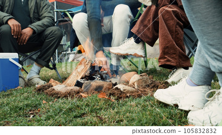 Wood, fire and warm hands on camping, trip or adventure in nature, forest or friends together at a bonfire in winter. Campfire, smoke and group relax on outdoor vacation, holiday or warming hand 105832832