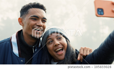 Selfie, love and a couple hiking in nature together for adventure, fun or to explore the wilderness. Photograph, travel and young people bonding while posing for a profile picture on social media 105833028