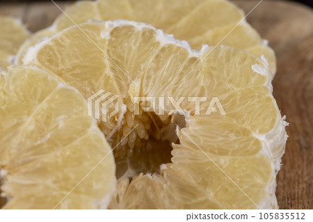 peeled pomelo on the table, close up peeled pomelo on the table, close up 105835512