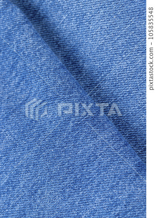 details of a blue denim fabric made of natural cotton 105835548
