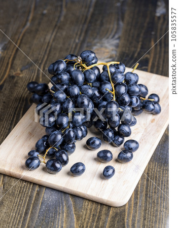 Unwashed blue grapes in the dust Unwashed blue grapes in the dust 105835577