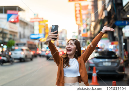 Young Asian tourists standing selfie taking a photo Young Asian tourists standing selfie taking a photo 105835604