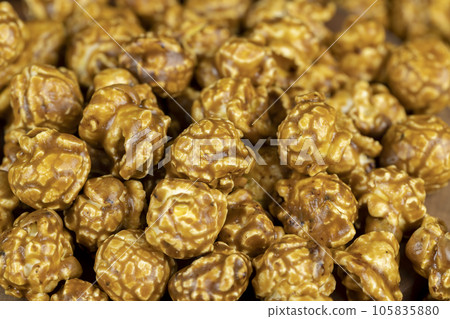 delicious sweet popcorn with lots of caramel delicious sweet popcorn with lots of caramel 105835880